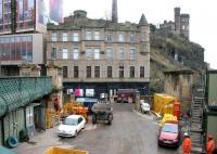 Looking northeast from the pedestrian footbridge towards Calton Road in March 2006. The former Royal Mail yard from which there is currently direct access to the north side of Waverley is being used by the project team carrying out the station modifications. Note the soon to be demolished stone column on the right which once supported the elevated pedestrian walkway to Jeffrey Street.<br><br>[John Furnevel 19/03/2006]