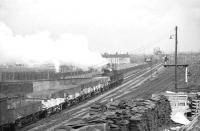 Ex-Caledonian 0-6-0, 57670, passing Whifflet South Junction with a northbound goods train in June 1963. The train is about to run through the site of the current (1992) Whifflet station.<br><br>[John Robin 07/06/1963]