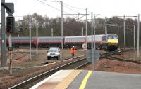 A GNER Kings Cross - Glasgow Central service about to cross the up West Coast Main Line as it runs into Carstairs from the Edinburgh direction on 22 March 2006.<br><br>[John Furnevel 22/03/2006]
