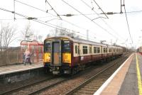 A Lanark - Dalmuir train, formed by unit 318266, pulls into Shieldmuir station on 22 March 2006.<br><br>[John Furnevel 22/03/2006]