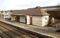 The main station building on the up platform at Carluke in March 2006, with the former goods shed beyond.<br><br>[John Furnevel 10/03/2006]