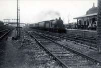 Grangemouth station. N.B 4.4.0 62497 Glen Mallie arriving from Glasgow (Queen Street).<br><br>[G H Robin collection by courtesy of the Mitchell Library, Glasgow 29/09/1952]