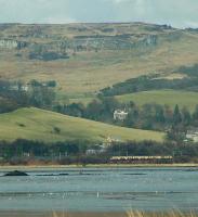 Eastbound train approaching Dumbuck with the Kilpatrick Hills behind.<br><br>[Ewan Crawford //]