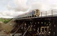 Allt na Slanaich Viaduct undergoing repairs. The only timber viaduct left on the British railway network gains some extra support.<br><br>[Ewan Crawford //2002]