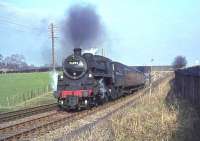 Standard class 4 2-6-0 76093 passes under Kennishead road with a Kilmarnock train in April 1965.<br><br>[John Robin 03/04/1965]
