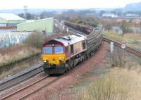 A PW train takes the line to Millerhill at Niddrie West Junction on 2 April 2006 behind EWS 66122.<br><br>[John Furnevel 02/04/2006]