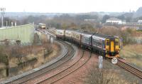 An Edinburgh - Kings Park football special comes off the single line from Portobello at Niddrie West Junction on the <I>sub</I> on 2 April 2006, while a diverted Glasgow - Edinburgh train waits at signals for the section to clear in order to complete its roundabout journey to Waverley.<br><br>[John Furnevel 02/04/2006]