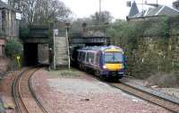 A diverted Waverley - Queen Street service passing west through the site of Newington station on Sunday 2 April 2006 on its way round the 'sub' to join the E&G main line at Haymarket West Junction.<br><br>[John Furnevel 02/04/2006]