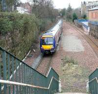 A diverted Sunday morning Edinburgh - Glasgow shuttle service westbound through the site of Newington station on 2 April 2006.<br><br>[John Furnevel 02/04/2006]