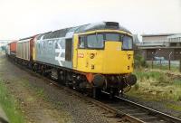 A 26 hauls a train out over Seafield level crossing and away from Leith.<br><br>[Ewan Crawford 12/06/1989]