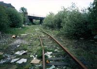 Rothesay Dock branch looking to Yoker Yard. Yoker for Renfrew Ferry station stood on the bridge over the line. Here the NB line (left) met the Caley line (right). The line was lifted and re-instated a few years later but has been closed and lifted now.<br><br>[Ewan Crawford //1987]