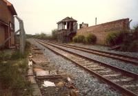 Maryhill Park Junction signalbox looking west, burned out. The equipment was moved to the building to the left but never used. Box now gone and station opened here.<br><br>[Ewan Crawford //1987]