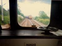 Immediately east of Westerton a West Highland train going west passes an eastbound 303.<br><br>[Ewan Crawford //1987]