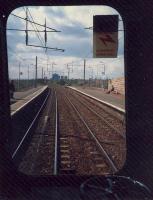 Passing through Wishaw. Ravenscraig gasometers in distance.<br><br>[Ewan Crawford //1987]