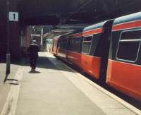 A passenger leaves the train at Dalmarnock.<br><br>[Ewan Crawford //1987]
