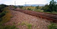 Clydebank Central Junction looking west seen through fence. The L&D crossed the extension to Dalmuir here and the connection was made (for Kilpatrick Oil and Chivas) and when the L&D was closed east from here. <br><br>[Ewan Crawford //1987]