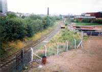 Whifflet Central Junction (NB) looking north. Behind the camera the lines to Palacecraig and Hamilton parted. Tennents works on right.<br><br>[Ewan Crawford //1987]
