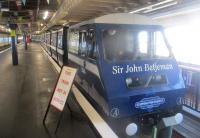 <h4><a href='/locations/S/Southend_Pier_Shore'>Southend Pier [Shore]</a></h4><p><small><a href='/companies/S/Southend_Pier_Railway'>Southend Pier Railway</a></small></p><p>'Sir John Betjeman', one of two diesel trains built for the reopening of the Southend Pier Railway in Essex on 2nd May 1986, at Shore station, on the morning of Bank Holiday Monday, 26th August 2019. Construction of the present pier began in 1887 and by 1892 a narrow gauge 3ft. 6ins. electric railway was running from the Shore to the Pier Head. By 1930, there were four trains of seven cars running on a double track. In 1949, new rolling stock was introduced in green and cream livery, closely resembling single deck trams and designed by AC Cars of Thames Ditton, Surrey. I well remember travelling on these on frequent family summer Sunday visits to Southend when I was a boy. In 1975, a fire partly destroyed the Pier Head but the railway kept on going until 1978 when it was closed due to deterioration of the decking and the 1949 trains were retired. That could have been the end but the railway reopened on 2nd May 1986, de-electrified and re-gauged from 3ft. 6 ins. to 3 ft. with two new trains, again of seven cars, designed by Severn Lamb of Alcester, Warwickshire. A second fire on 9th October 2005, 30 years after the first, destroyed Pier Head station and a temporary stop was used until a new station on the site of the old Pier Head was opened on 9th February 2009. 3/12</p><p>26/08/2019<br><small><a href='/contributors/David_Bosher'>David Bosher</a></small></p>