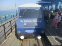 <h4><a href='/locations/S/Southend_Pier_Pier_Head'>Southend Pier [Pier Head]</a></h4><p><small><a href='/companies/S/Southend_Pier_Railway'>Southend Pier Railway</a></small></p><p>'Sir William Heygate', one of two trains built for the reopening of the Southend Pier Railway in 1986, re-gauged from 3ft 6 ins. to 3ft. and reduced from double to single track with a midway passing loop, just arrived at Pier Head station, on the sweltering morning of Bank Holiday Monday, 26th August 2019. A fire on 9th October 2005 destroyed the old Pier Head station; a temporary terminus just to the south was used until the station seen here opened on the original Pier Head station site on 9th February 2009. 7/12</p><p>26/08/2019<br><small><a href='/contributors/David_Bosher'>David Bosher</a></small></p>