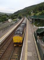 <h4><a href='/locations/T/Tirphil'>Tirphil</a></h4><p><small><a href='/companies/R/Rhymney_Railway'>Rhymney Railway</a></small></p><p>37421 hauls the second evening commuter train from Cardiff Central to Rhymney out of Tirphil on 27th August 2019. Fans of the class 37 exhaust note should enjoy these trains, as there are some 15 stops - especially tuneful uphill. We had risen at 04.30 to catch the 07.24 into Cardiff - a long day. see image <a href='/img/25/707/index.html'>25707</a> for the same station looking rather less spruce over 30 years ago. 119/125</p><p>27/08/2019<br><small><a href='/contributors/Ken_Strachan'>Ken Strachan</a></small></p>
