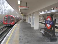 <h4><a href='/locations/L/Loughton'>Loughton</a></h4><p><small><a href='/companies/O/Ongar_Extension_Great_Eastern_Railway'>Ongar Extension (Great Eastern Railway)</a></small></p><p>LUL 1992 stock on a Central Line train to Epping departing from Loughton station, on 23rd December 2013. This is the Essex town's third station; the first was opened by the Eastern Counties Railway on 22nd August 1856 as the terminus of the line from Stratford. It was replaced with a new station by the Great Eastern Railway which extended the line to Ongar on 24th April 1865, the extension diverging just outside the original terminus which became a goods yard. In anticipation of the electrification of the line for LPTB Central Line trains, the present station was opened on 21st April 1940 but World War Two delayed the scheme and it was 21st November 1948 before tube trains reached Loughton with extension to Epping on 25th September 1949. The goods yard on the site of the 1856 station remained open until 1966, served by steam trains using the original ECR route between Stratford (Loughton Branch Junction) and Leyton and which remained in use for early morning DMU staff trains until 1970. 8/30</p><p>23/12/2013<br><small><a href='/contributors/David_Bosher'>David Bosher</a></small></p>