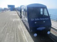 <h4><a href='/locations/S/Southend_Pier_Pier_Head'>Southend Pier [Pier Head]</a></h4><p><small><a href='/companies/S/Southend_Pier_Railway'>Southend Pier Railway</a></small></p><p>'Sir John Betjeman' at the 2009 Pier Head station, Southend Pier Railway, Essex, on 26th August 2019. The original Pier Head station was destroyed by fire on 9th October 2005; a temporary terminus just to the south was used until the present Pier Head station opened, on the site of the old, on 9th February 2009. 4/12</p><p>26/08/2019<br><small><a href='/contributors/David_Bosher'>David Bosher</a></small></p>