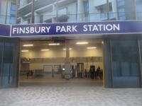 <h4><a href='/locations/F/Finsbury_Park_GNPBR'>Finsbury Park [GNPBR]</a></h4><p><small><a href='/companies/G/Great_Northern,_Piccadilly_and_Brompton_Railway'>Great Northern, Piccadilly and Brompton Railway</a></small></p><p>New north side entrance to Finsbury Park Underground station, LUL Piccadilly and Victoria Lines, on 29th December 2019.    This opened on 17th December 2019, almost a year late and there is still currently no direct access to and from Wells Terrace Bus station.  Since 2016 when the original north side entrance closed, bus passengers have had to make a long detour under Stroud Green Road bridge to the Station Place entrance. From what I could see, when the hoarding (behind me when I took this photo) is removed, there will still be a short walk to Wells Terrace for bus interchange (at the moment, a longer walk via Fonthill Road is required) whereas the old north side entrance led directly to and from the bus station to the tube lines. The long sloping subway of the old entrance with its original Edwardian tiles has disappeared for good. 60/138</p><p>29/12/2019<br><small><a href='/contributors/David_Bosher'>David Bosher</a></small></p>