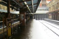 <h4><a href='/locations/B/Barbican'>Barbican</a></h4><p><small><a href='/companies/W/Widened_Lines_Metropolitan_Railway'>Widened Lines (Metropolitan Railway)</a></small></p><p>The disused Widened Lines platforms at Barbican station, with the still extant Circle, Hammersmith & City and Metropolitan Lines platforms on the left, looking east in the snow on Sunday, 20th January 2013. This station opened as Aldersgate Street in 1865 with the extension of the Metropolitan Railway from Farringdon Street (now Farringdon) to Moorgate Street (now Moorgate) and was renamed Aldersgate & Barbican in 1923 (though it was never shown on the famous London Underground diagram as such, only as Aldersgate) and finally to just Barbican in 1968.  The former all-over glass roof was destroyed in the London Blitz of World War Two and the frame was taken down in 1955 but it is still possible to see the support brackets on the walls of the two side platforms, above the replacement canopies. For many years, this station was closed on Sundays but is now open full-time again. 9/44</p><p>20/01/2013<br><small><a href='/contributors/David_Bosher'>David Bosher</a></small></p>