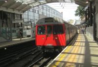 <h4><a href='/locations/F/Farringdon'>Farringdon</a></h4><p><small><a href='/companies/M/Metropolitan_Railway'>Metropolitan Railway</a></small></p><p>Now withdrawn LUL C stock, on a clockwise Circle Line service, arriving at Farringdon station on a scorching hot 13th July 2013. This station was the original terminus of the Metropolitan Railway, the world's first Underground line, opened on 10th January 1863 as Farringdon Street and renamed Farringdon & High Holborn in 1923 before becoming simply Farringdon in 1936. The station is actually in the district of Clerkenwell and there have been many suggestions over the years that it should be renamed so, but so far to no avail. 9/14</p><p>13/07/2013<br><small><a href='/contributors/David_Bosher'>David Bosher</a></small></p>