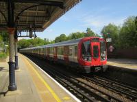 <h4><a href='/locations/C/Chorleywood'>Chorleywood</a></h4><p><small><a href='/companies/C/Chesham_Branch_Harrow_and_Rickmansworth_Railway'>Chesham Branch (Harrow and Rickmansworth Railway)</a></small></p><p>LUL S8 stock on Metropolitan Line service to Amersham arriving at Chorleywood on 27th May 2013. This ztfL station is also served by Chiltern Trains from Marylebone to Aylesbury Vale Parkway. When the East/West Rail is completed, Chiltern Trains will be extended to Milton Keynes Central via a reopened section of the old GCR main line and the Calvert spur on to the Oxford to Bletchley line (also to be reopened) at Claydon LNE Junction. Even with a change at Milton Keynes, the new route will provide Aylesbury again with a link to the Midlands and North which was lost when the GCR was closed in 1966 as part of the Beeching cuts. 10/21</p><p>27/05/2013<br><small><a href='/contributors/David_Bosher'>David Bosher</a></small></p>