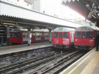 <h4><a href='/locations/E/Edgware_Road'>Edgware Road</a></h4><p><small><a href='/companies/M/Metropolitan_Railway'>Metropolitan Railway</a></small></p><p>Fast approaching the end of their days, and each in a grubby condition, three now withdrawn LU C stock trains are seen at Edgware Road station on 13th January 2013. This stock, the Underground's final link with the 1960s, was withdrawn from service the following year. 5/14</p><p>13/01/2013<br><small><a href='/contributors/David_Bosher'>David Bosher</a></small></p>