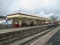 <h4><a href='/locations/R/Ramsbottom'>Ramsbottom</a></h4><p><small><a href='/companies/E/East_Lancashire_Railway'>East Lancashire Railway</a></small></p><p>The splendid station building and awning on the northbound platform at Ramsbottom, East Lancashire Railway, during a lull between trains, on 5th April 2016. Even before the original closure by BR in June 1972, the station had fallen into a deplorable state with all buildings demolished and the southbound platform abandoned <a href='/img/21/550/index.html'>21550</a>. It took 15 years before it could reopen with trains to and from Bury Bolton Street in 1987, the extension to Rawtenstall opening in 1991. Work to restore Ramsbottom to this condition has continued through to the present.   It is one of my favourite heritage stations and really blends with the delightful old town that it once again serves. 16/17</p><p>05/04/2016<br><small><a href='/contributors/David_Bosher'>David Bosher</a></small></p>