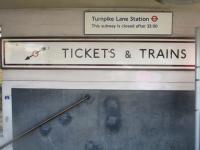 <h4><a href='/locations/T/Turnpike_Lane'>Turnpike Lane</a></h4><p><small><a href='/companies/P/Piccadilly_Extension_London_Electric_Railways'>Piccadilly Extension (London Electric Railways)</a></small></p><p>Original Tickets & Trains sign, with more modern sign above, at one of the stairwell entrances to Turnpike Lane, LUL Piccadilly Line, on 16th September 2020. This station, designed by Dr. Charles Holden (1875-1960), the Underground's Chief Architect between the two World Wars, opened on 19th September 1932 with the first stage of the Cockfosters extension from Finsbury Park to Arnos Grove. 64/138</p><p>16/09/2020<br><small><a href='/contributors/David_Bosher'>David Bosher</a></small></p>