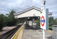 <h4><a href='/locations/B/Brent_Cross'>Brent Cross</a></h4><p><small><a href='/companies/E/Edgware_Extension_London_Electric_Railways'>Edgware Extension (London Electric Railways)</a></small></p><p>Brent Cross, LUL Northern Line, looking north towards Edgware on 26th August 2020. On the left is the formation of the former loop (with a similar one on the southbound side) which in early days allowed semi-fast trains to overtake here. These semi-fasts ceased around the time the LPTB was formed in 1933 and the tracks were removed. Highfield Avenue bridge immediately south of the station still demonstrates the wider line at this location but then narrows down to a two-track railway. 62/138</p><p>26/08/2020<br><small><a href='/contributors/David_Bosher'>David Bosher</a></small></p>