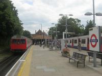 <h4><a href='/locations/S/Southfields'>Southfields</a></h4><p><small><a href='/companies/W/Wimbledon_and_Putney_Line_London_and_South_Western_Railway'>Wimbledon and Putney Line (London and South Western Railway)</a></small></p><p>A scene at Southfields, on the Wimbledon branch of the District Line, that can now never be repeated, following the withdrawal of the C and D78 stock trains. On the left a C stock departs for Wimbledon while on the right a D78 stock arrives for Edgware Road on 31st May 2014. 14/14</p><p>31/05/2014<br><small><a href='/contributors/David_Bosher'>David Bosher</a></small></p>