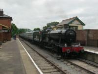 <h4><a href='/locations/N/North_Weald'>North Weald</a></h4><p><small><a href='/companies/O/Ongar_Extension_Great_Eastern_Railway'>Ongar Extension (Great Eastern Railway)</a></small></p><p>GWR Hall Class 4-6-0 4953 'Pitchford Hall' arriving at North Weald on the Epping Ongar Railway on 2nd June 2012. Built at Swindon in August 1929, it was withdrawn in May 1963, finding its way to Woodham's scrapyard at Barry. It was purchased for preservation by a Dr. John Kennedy in 1984 and moved to Tyseley for restoration, eventually moving under its own steam again for the first time in just over 40 years in February 2004. It was sold to the Epping Ongar Railway in 2011, shortly before the line reopened. This station nowadays looks as if it might well be on a different planet to the days when LUL Central Line trains called here from 1957 to 1994.  3/25</p><p>02/06/2012<br><small><a href='/contributors/David_Bosher'>David Bosher</a></small></p>
