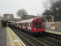 <h4><a href='/locations/E/Eastcote'>Eastcote</a></h4><p><small><a href='/companies/H/Harrow_and_Uxbridge_Railway'>Harrow and Uxbridge Railway</a></small></p><p>LUL S8 stock on a Metropolitan Line service from Uxbridge to Aldgate arriving at Eastcote on 13th February 2013. This station, also served by the Piccadilly Line, was originally a tin hut halt opened in 1906, two years after the line opened in 1904 and was rebuilt as a station in 1939 to the designs of Dr. Charles Holden (1875-1960), the London Underground's Chief Architect between the two world wars. 5/21</p><p>13/02/2013<br><small><a href='/contributors/David_Bosher'>David Bosher</a></small></p>