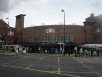 <h4><a href='/locations/W/Wood_Green'>Wood Green</a></h4><p><small><a href='/companies/P/Piccadilly_Extension_London_Electric_Railways'>Piccadilly Extension (London Electric Railways)</a></small></p><p>Exterior of Wood Green station, Piccadilly Line, on 11th May 2021. This was opened with the first stage of the Cockfosters extension from Finsbury Park to Arnos Grove on 19th September 1932 and designed by Dr. Charles Holden (1875-1960), the Underground's Chief Architect between the two world wars. This, however, is where the money started to run out: the first two stations on the extension at Manor House and Turnpike Lane all had stairwell entrances to the street corners whereas Wood Green is boxed into a corner site without pedestrian subways to the other corners of the crossroads, on the north-east side of which it is situated. 68/138</p><p>11/05/2021<br><small><a href='/contributors/David_Bosher'>David Bosher</a></small></p>