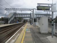 <h4><a href='/locations/A/Acton_Main_Line'>Acton Main Line</a></h4><p><small><a href='/companies/G/Great_Western_Railway'>Great Western Railway</a></small></p><p>Acton Main Line, originally opened in 1868, looking east towards Paddington, on 22nd May 2021. After a long delay, the new footbridge and ticket hall, incorporating lifts to give step free access for the first time in the station's 153 year history, was opened on 18th March 2021.   The obsolete up platform on the main line tracks (on right) is now fenced off while, further right, the down platform has been demolished. 126/189</p><p>22/05/2021<br><small><a href='/contributors/David_Bosher'>David Bosher</a></small></p>