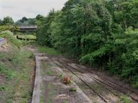 <h4><a href='/locations/C/Cameron_Bridge_1st'>Cameron Bridge [1st]</a></h4><p><small><a href='/companies/L/Leven_Railway'>Leven Railway</a></small></p><p>Looking east from the closed Cameron Bridge station on 12th July 2021. Vegetation has been removed to allow for track lifting, scheduled for the next few weeks.  The new station is to be located beyond the A915 bridge in the background.<br> 29/43</p><p>12/07/2021<br><small><a href='/contributors/Bill_Roberton'>Bill Roberton</a></small></p>