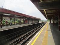 <h4><a href='/locations/B/Becontree'>Becontree</a></h4><p><small><a href='/companies/B/Barking_to_Upminster_Quadrupling_London,_Midland_and_Scottish_Railway'>Barking to Upminster Quadrupling (London, Midland and Scottish Railway)</a></small></p><p>Becontree, looking west towards London, on 24th June 2021. This replaced the LTSR Gale Street Halt that had been opened in 1926 and is the only four-platform station built when the LMS provided two extra tracks alongside the LTSR tracks from Barking to Upminster in 1932 for the exclusive use of District Line trains. These were eventually transferred to London Transport in 1969. Main line trains from Fenchurch Street to Shoeburyness, however, had ceased to call in 1962 when the line was electrified, resulting in the platforms on those tracks becoming disused. These are visible on the left and now fenced off from the surviving District Line platforms.  The dark maroon colour scheme of the canopies is a nice touch, as it acts as a memorial to the London, Midland & Scottish Railway who originally opened the station nearly 90 years ago. 76/138</p><p>24/06/2021<br><small><a href='/contributors/David_Bosher'>David Bosher</a></small></p>