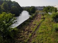 <h4><a href='/locations/L/Levenmouth'>Levenmouth</a></h4><p><small><a href='/companies/L/Leven_Dock_Railway'>Leven Dock Railway</a></small></p><p>Looking up river from the Bawbee Bridge on 26th August 2021, with old track finally lifted from the Methil branch. The new Levenmouth station will be below. See <a href='/img/66/505/index.html'>66505</a> for the same location in 1992. 40/43</p><p>26/08/2021<br><small><a href='/contributors/Bill_Roberton'>Bill Roberton</a></small></p>