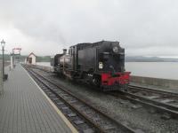<h4><a href='/locations/P/Porthmadog_Harbour_WHR'>Porthmadog Harbour [WHR]</a></h4><p><small><a href='/companies/F/Festiniog_Railway'>Festiniog Railway</a></small></p><p>Ex-South African Railways NGG16 2-6-2+2-6-2T Garratt no.87, built 1937 by the engineering firm Cockerill and restored at the Ffestiniog Railway's Boston Lodge works, shunting at Porthmadog Harbour station before being attached to a Welsh Highland Railway train to Caernarfon, on 22nd May 2016. 18/75</p><p>22/05/2016<br><small><a href='/contributors/David_Bosher'>David Bosher</a></small></p>