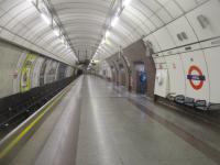 <h4><a href='/locations/A/Angel'>Angel</a></h4><p><small><a href='/companies/C/City_and_South_London_Railway'>City and South London Railway</a></small></p><p>The wide southbound platform at Angel, Northern Line, on 20th November 2021. But it wasn't always so as, when opened by the City & South London Railway in 1901 and for the next 91 years, it had a narrow island platform in a single tunnel. By the end of the 1980s this had become totally inadequate and the whole station was rebuilt, the new being unveiled in 1992. The northbound platform on the south side of the island was abolished and built over, while the southbound on the north side was retained, leaving a very wide southbound platform. A new tunnel for northbound trains was constructed, leaving and rejoining the 1901 track either side of Angel station, to accommodate a new northbound platform which is of normal width with new passageways driven through the former tunnel wall to connect them. The old entrance on City Road was abandoned and replaced by a new one on Islington High Street. The former CSLR platforms at Euston also included a single island platform which disappeared during the construction of the Victoria Line in the 1960s but two examples of how Angel once looked survive at Clapham North and Clapham Common on the southern section of the Northern Line. 96/138</p><p>20/11/2021<br><small><a href='/contributors/David_Bosher'>David Bosher</a></small></p>