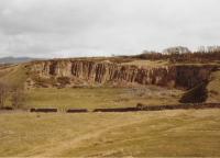 <h4><a href='/locations/R/Ravelrig_Quarry'>Ravelrig Quarry</a></h4><p><small><a href='/companies/R/Ravelrig_Quarries_Tramway'>Ravelrig Quarries Tramway</a></small></p><p>Ravelrig Quarry, disused, seen in 1985. The quarry was served by a series of tramways which ran to Dalmahoy Siding on the Balerno branch. 4/81</p><p>//1985<br><small><a href='/contributors/Don_Shaw'>Don Shaw</a></small></p>