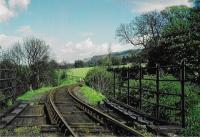 <h4><a href='/locations/C/Currie_2nd'>Currie [2nd]</a></h4><p><small><a href='/companies/B/Balerno_Branch_Caledonian_Railway'>Balerno Branch (Caledonian Railway)</a></small></p><p>A view east of Currie station looking towards Kinleith Mill. The station loop is behind the camera. 31/81</p><p>//<br><small><a href='/contributors/Don_Shaw'>Don Shaw</a></small></p>