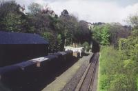 <h4><a href='/locations/C/Colinton'>Colinton</a></h4><p><small><a href='/companies/B/Balerno_Branch_Caledonian_Railway'>Balerno Branch (Caledonian Railway)</a></small></p><p>Colinton station seen from the bridge in a view looking east towards the tunnel in the 1960s. At the time the line was still open to goods only traffic. 59/81</p><p>//<br><small><a href='/contributors/Don_Shaw'>Don Shaw</a></small></p>