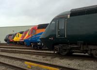 <h4><a href='/locations/S/St_Philips_Marsh_Depot'>St Philips Marsh Depot</a></h4><p><small><a href='/companies/B/Bristol_West_Junction_to_Bristol_East_Junction_Great_Western_Railway'>Bristol West Junction to Bristol East Junction (Great Western Railway)</a></small></p><p>A lovely nostalgic image from the HSTs 40th birthday party. See image <a href='/img/54/970/index.html'>54970</a> for a full list of the liveries seen here. This now seems to be a lot more than 5.5 years ago. I doubt I will ever see a lineup like this again; though I had an accidental last sighting of an XC HST at Tamworth while heavily delayed there returning from Bath to Nuneaton. 76/122</p><p>02/05/2016<br><small><a href='/contributors/Ken_Strachan'>Ken Strachan</a></small></p>