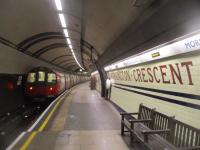 <h4><a href='/locations/M/Mornington_Crescent'>Mornington Crescent</a></h4><p><small><a href='/companies/C/Charing_Cross,_Euston_and_Hampstead_Railway'>Charing Cross, Euston and Hampstead Railway</a></small></p><p>LUL 1995 stock heading away from the camera as it departs from Mornington Crescent with a Northern Line service to High Barnet on 5th June 2021. This station survived a closure attempt in 1958 but was closed at weekends from 1970 for many years; however, it is now open full-time again. There was a period of temporary closure, between 1992 and 1998, to renew the lifts when the opportunity was also taken to refurbish the platforms too. 54/87</p><p>05/06/2021<br><small><a href='/contributors/David_Bosher'>David Bosher</a></small></p>
