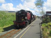 <h4><a href='/locations/R/Rhyd_Ddu'>Rhyd Ddu</a></h4><p><small><a href='/companies/N/North_Wales_Narrow_Gauge_Railway'>North Wales Narrow Gauge Railway</a></small></p><p>On the return Welsh Highland Railway journey from Caernarfon to Porthmadog Harbour, on the afternoon of 22nd May 2016, another lengthy wait ensued at Rhyd-Ddu station for a Caernarfon train to arrive, clearing the single line. Ex-South African Railways NSGG class 16 2-6-2+2-6-2 No.138 eventually arrived at Rhyd-Ddu and in common with stations on the sister Ffestiniog Railway, is crossing on the right.   The weather had improved considerably by this time to when I set off from Porthmadog in the morning. 8/10</p><p>22/05/2016<br><small><a href='/contributors/David_Bosher'>David Bosher</a></small></p>
